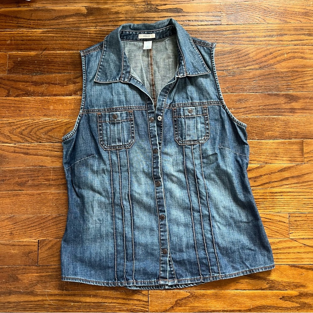 Denim vest worn only a handful of time. In very good shape.